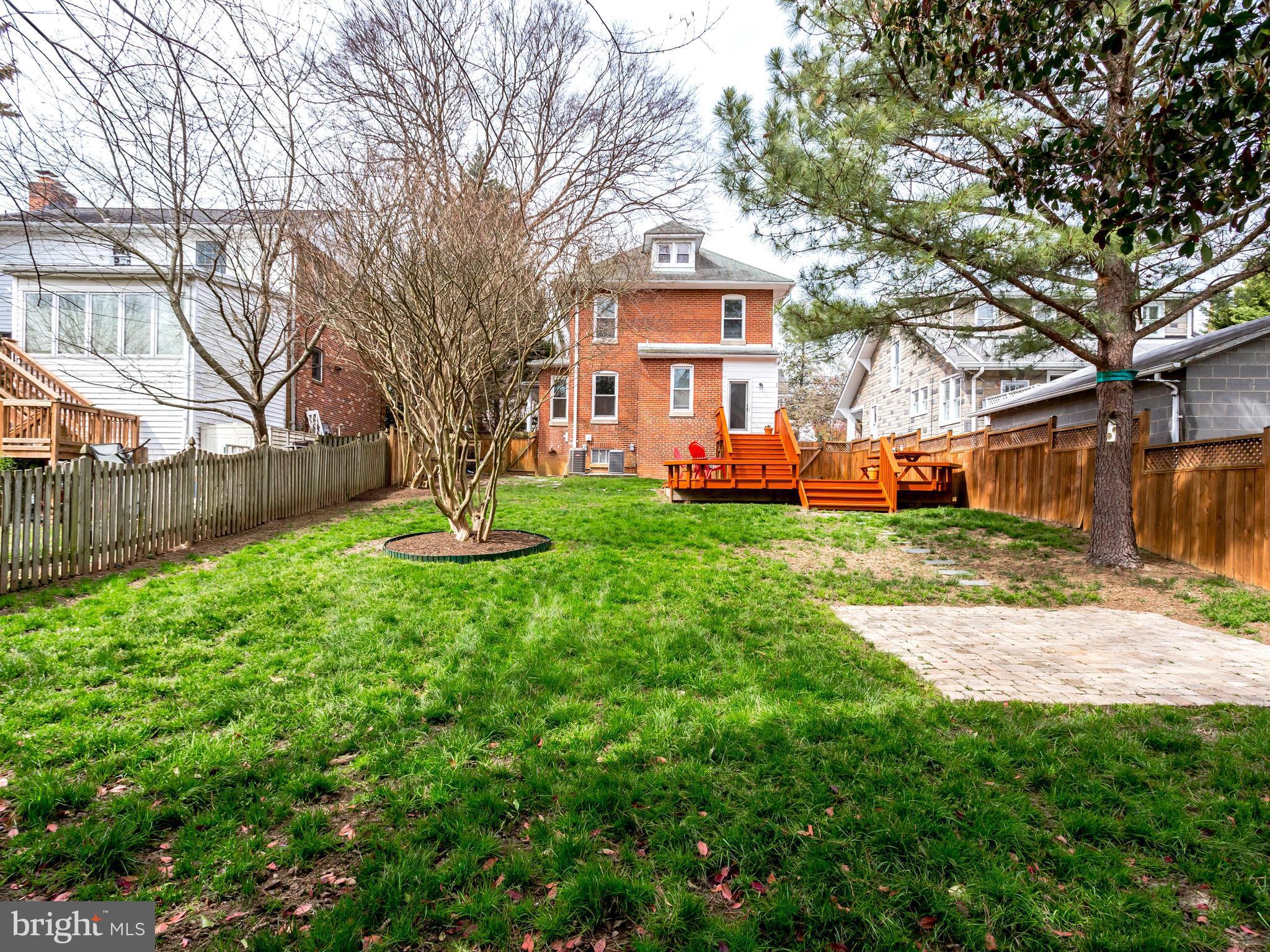 1107 Russell Road Alexandria, VA 22301 - Photo 26 of 29 a front view of a house with a yard and fountain
