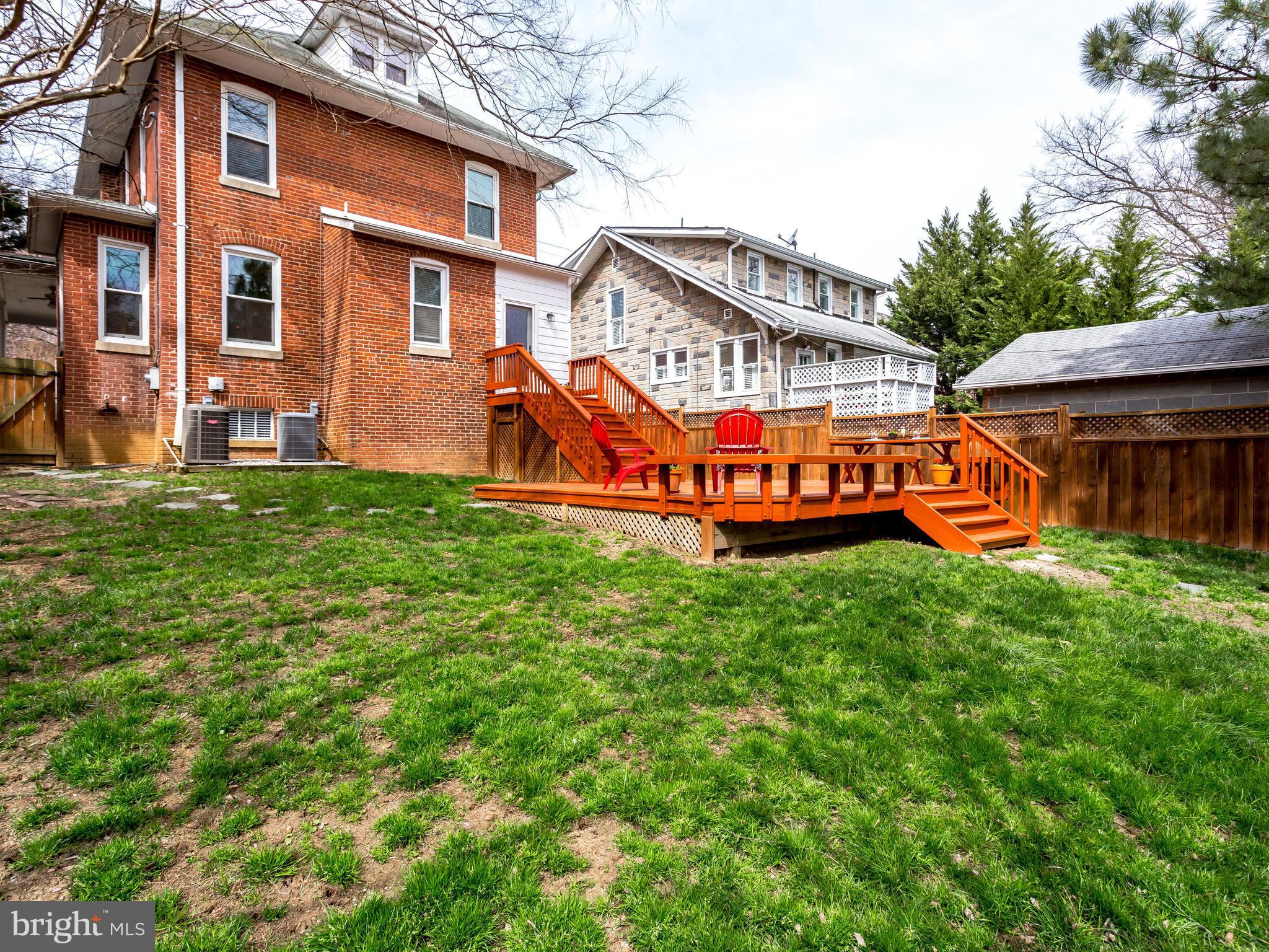 1107 Russell Road Alexandria, VA 22301 - Photo 28 of 29 a view of a house with a big yard and large trees