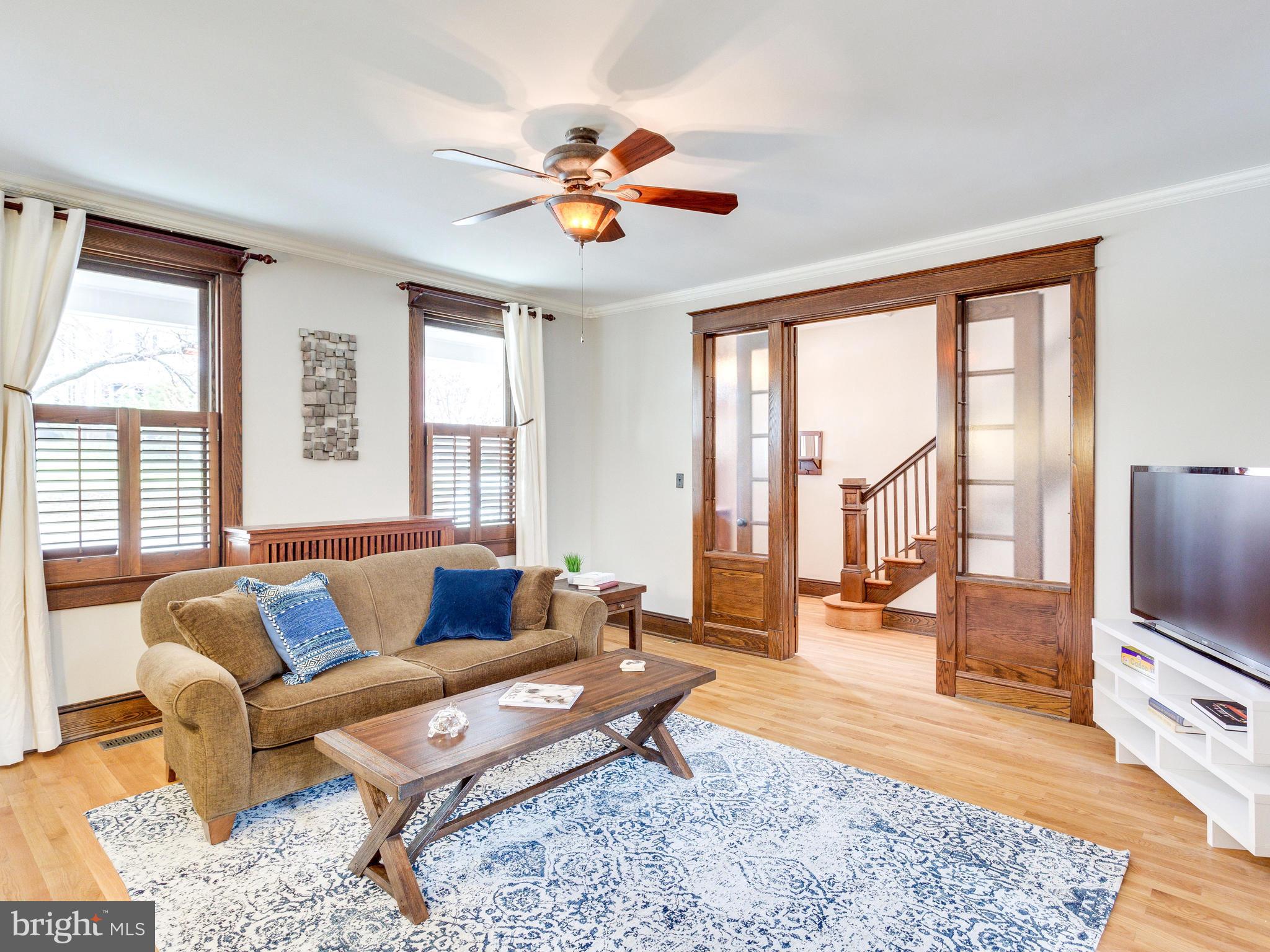 1107 Russell Road Alexandria, VA 22301 - Photo 5 of 29 a living room with furniture and a flat screen tv