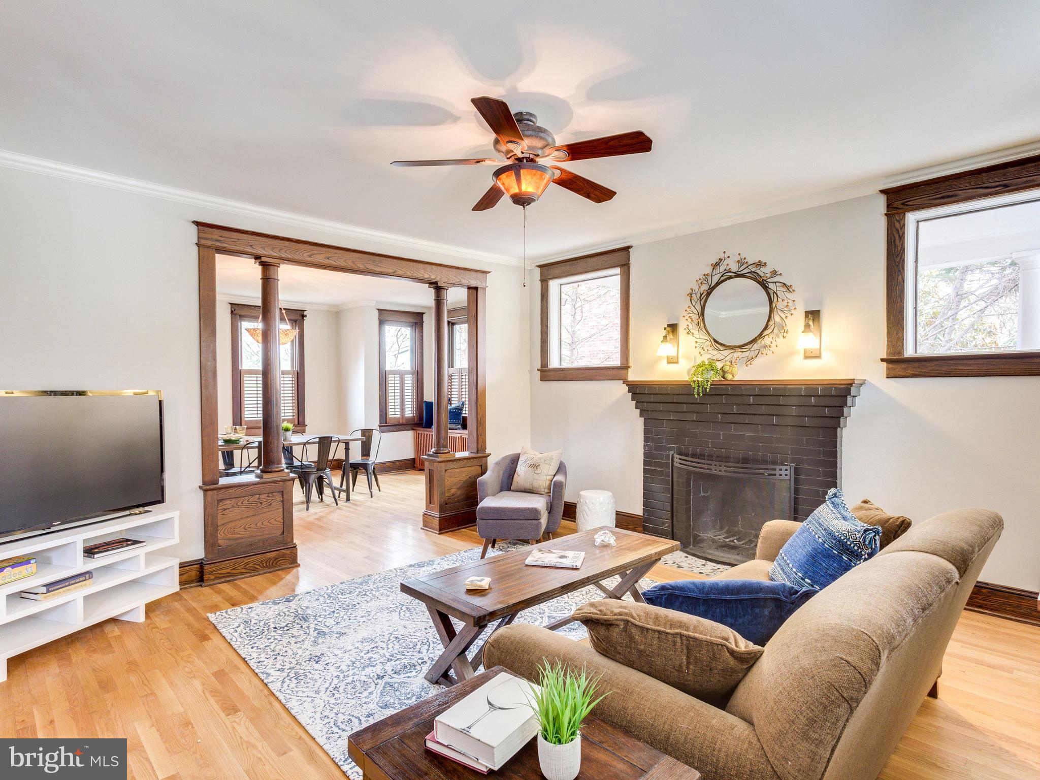 1107 Russell Road Alexandria, VA 22301 - Photo 6 of 29 a living room with furniture a flat screen tv and a large window