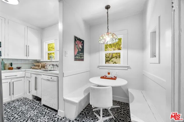 a kitchen with a sink and a stove