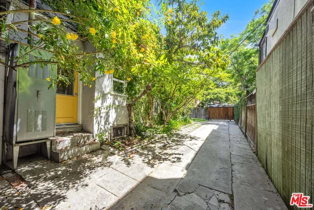 a view of a pathway with a yard