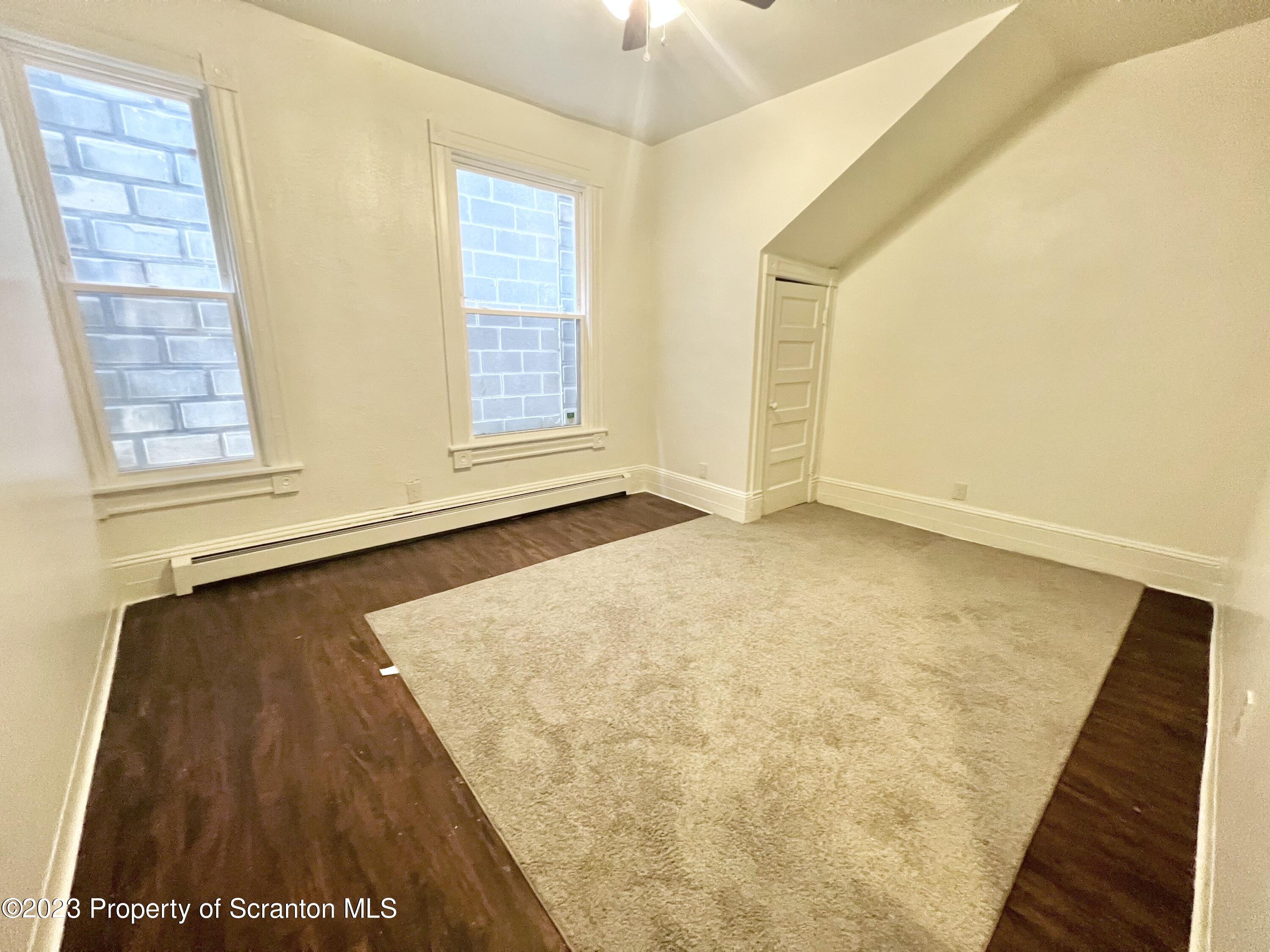 1930 Boulevard Avenue, Unit 1 Scranton, PA 18509 - Photo 7 of 9 a view of an empty room with a window