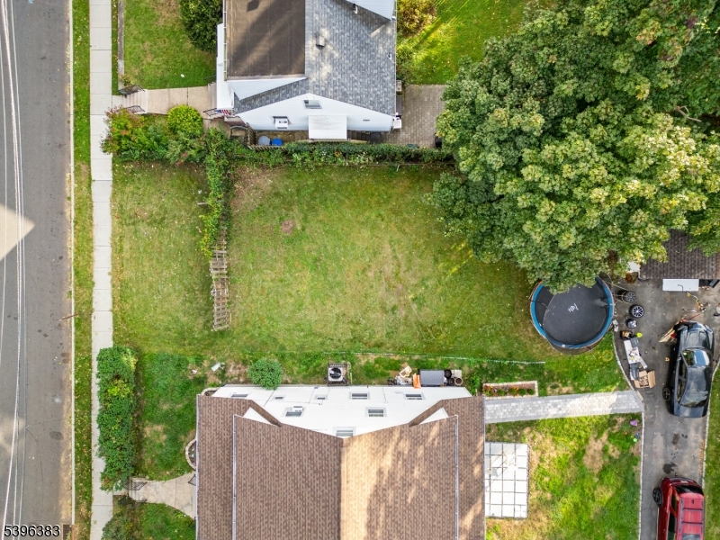 389 Olcott Street Orange, NJ 07050 - Photo 3 of 12 an aerial view of a house with yard swimming pool and outdoor seating