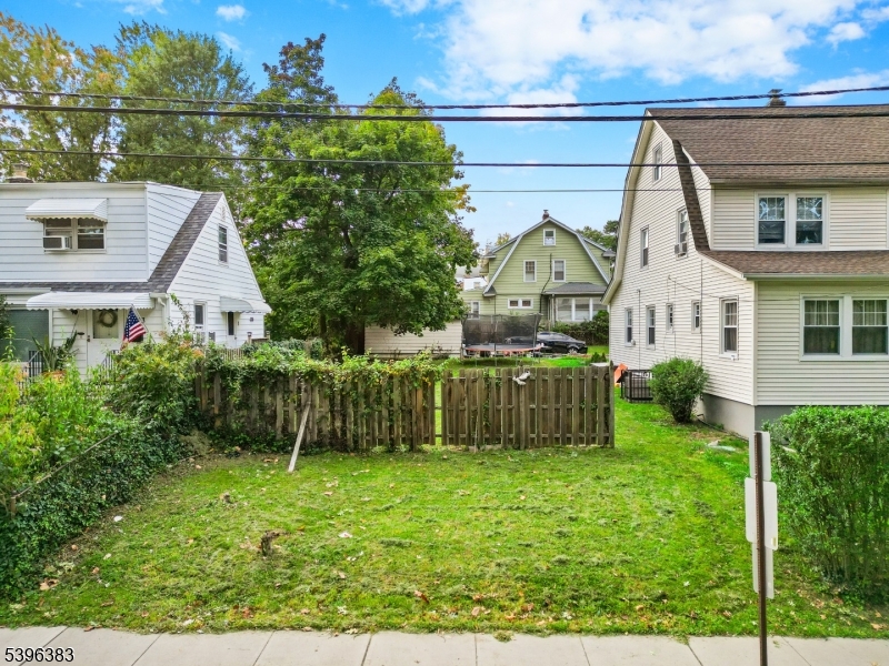 389 Olcott Street Orange, NJ 07050 - Photo 4 of 12 a view of a house with a backyard