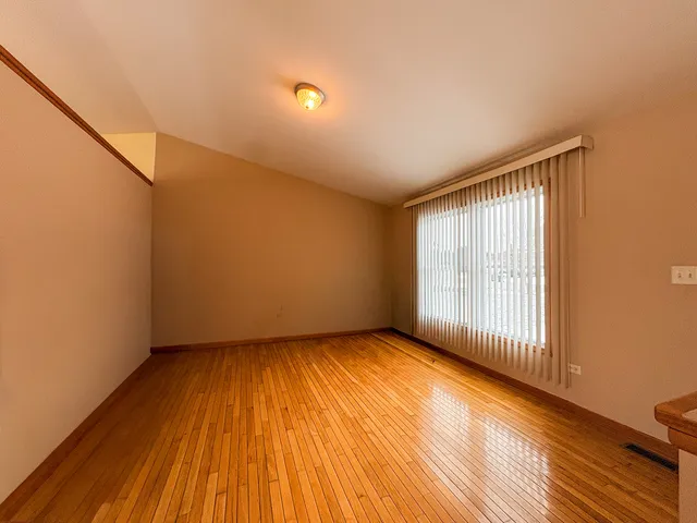 an empty room with closet area