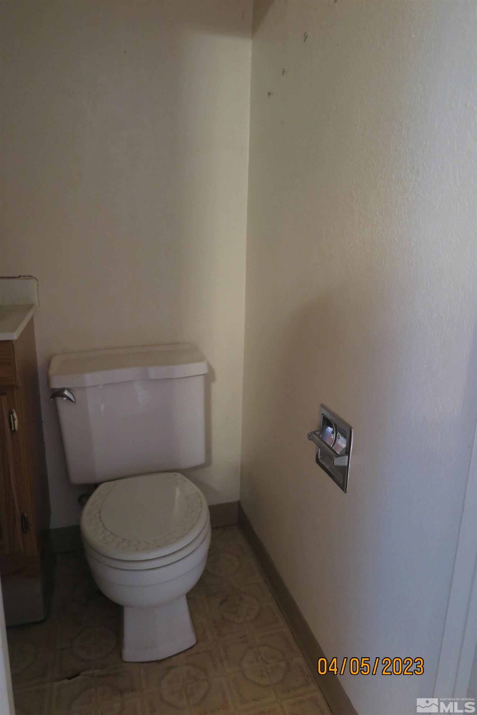 208 Rhodes Road Reno, NV 89521 - Photo 12 of 33 a white toilet sitting next to a white wall