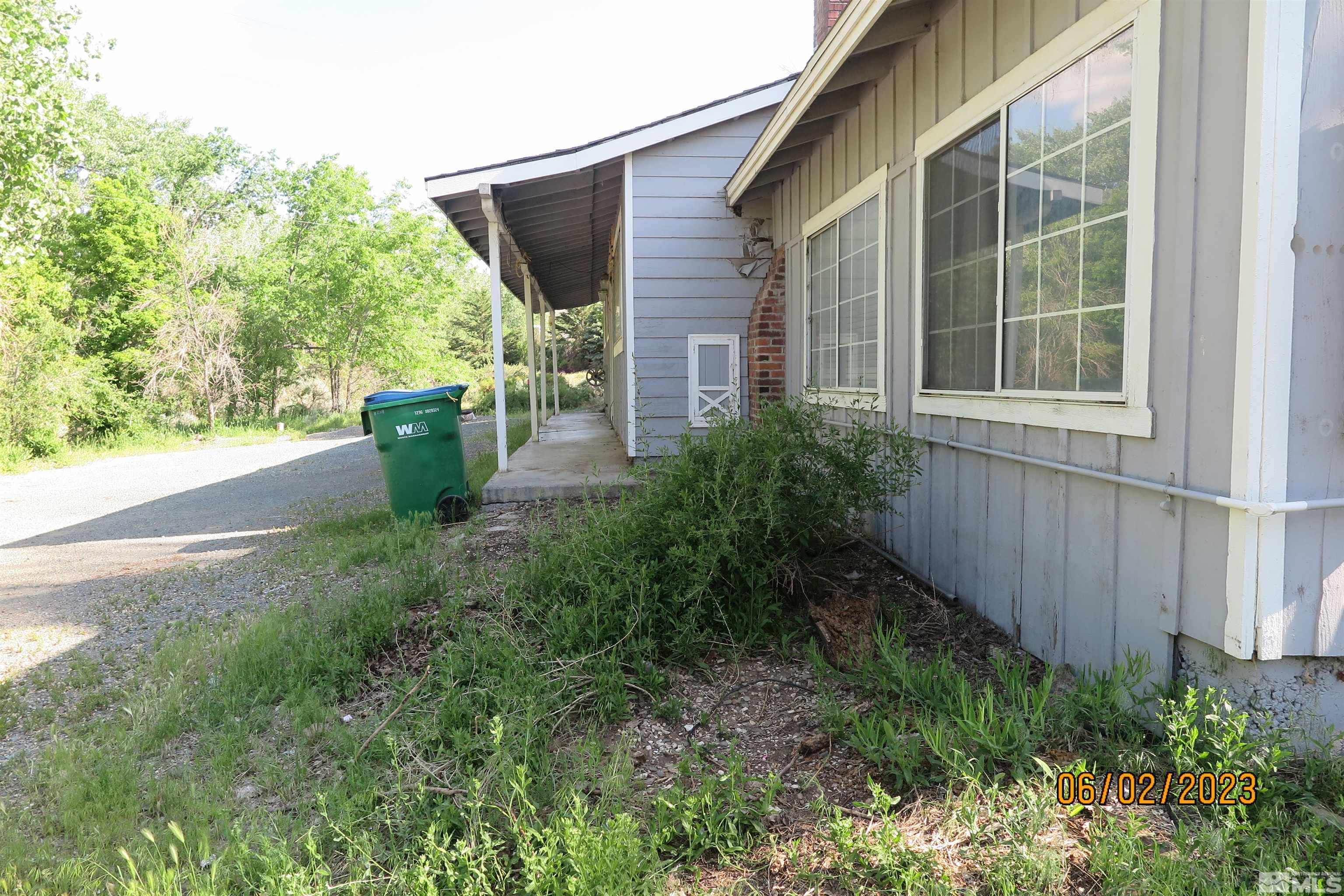 208 Rhodes Road Reno, NV 89521 - Photo 2 of 33 a view of potted plants in front of a house