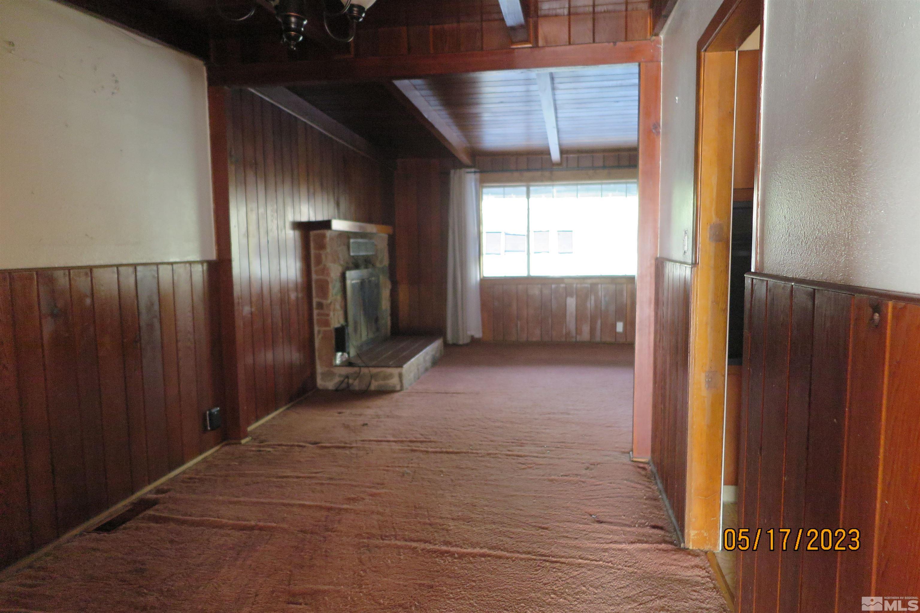 208 Rhodes Road Reno, NV 89521 - Photo 22 of 33 a view of an empty room with a window