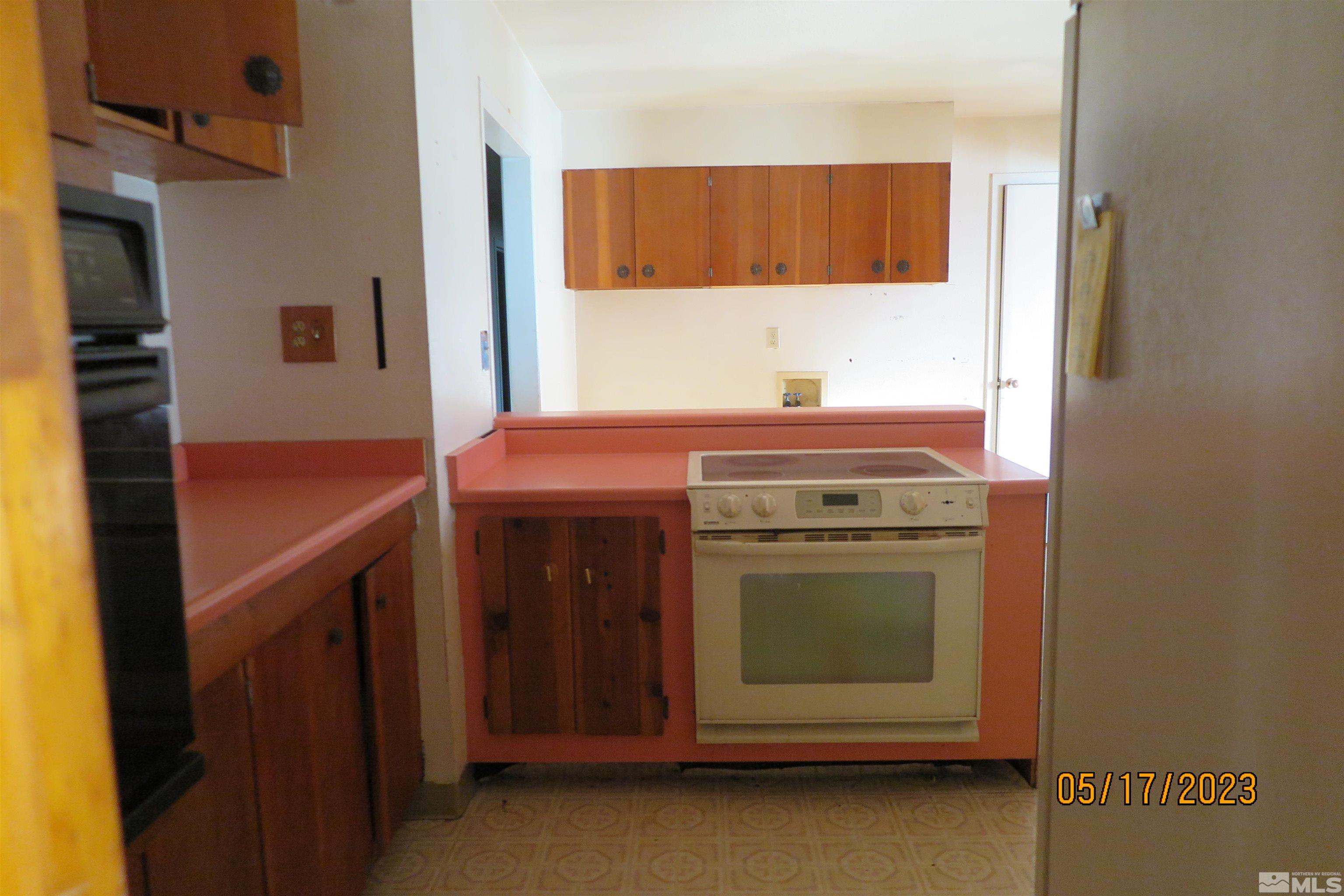 208 Rhodes Road Reno, NV 89521 - Photo 23 of 33 a kitchen with a stove and a sink