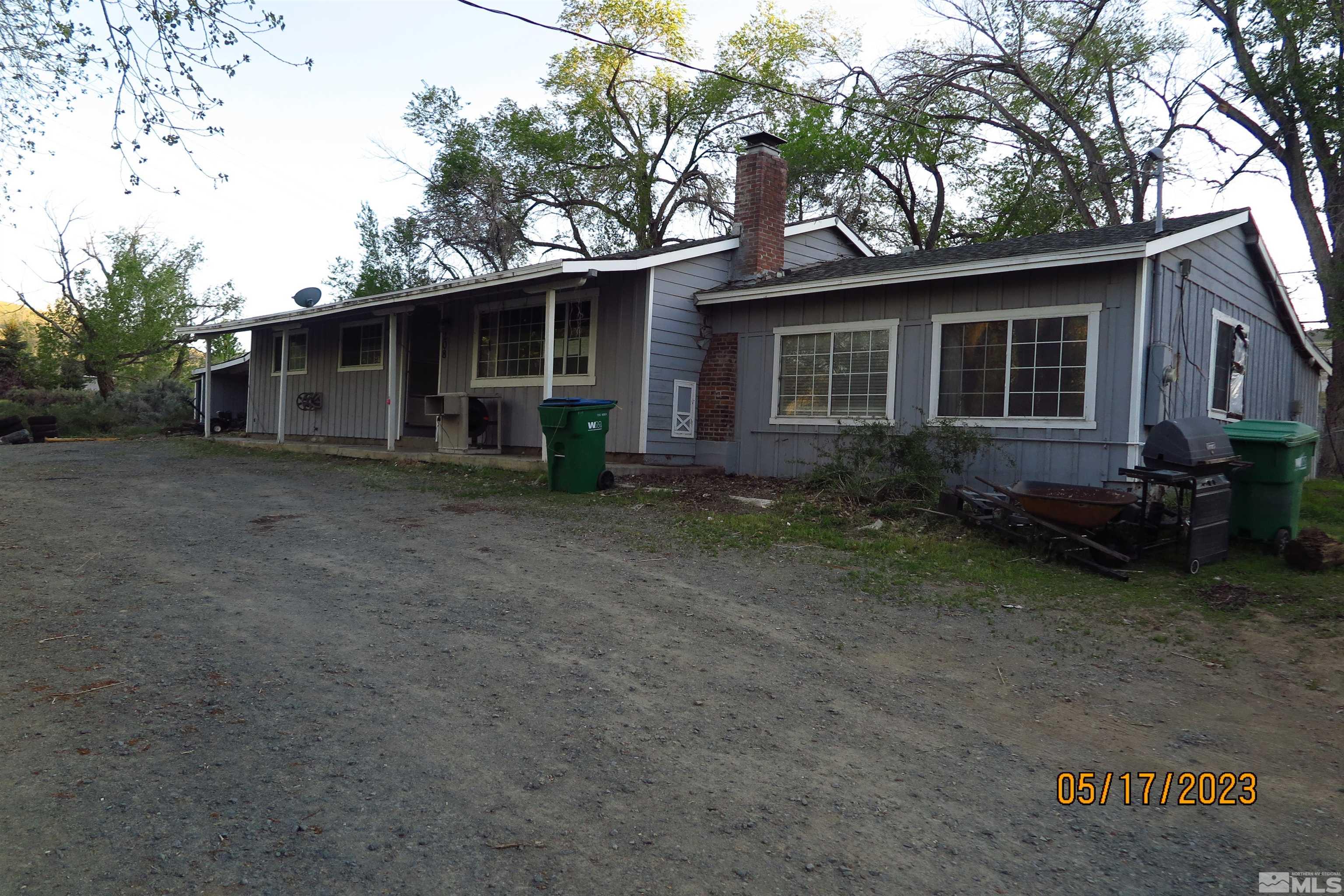 208 Rhodes Road Reno, NV 89521 - Photo 32 of 33 a view of a house with a yard