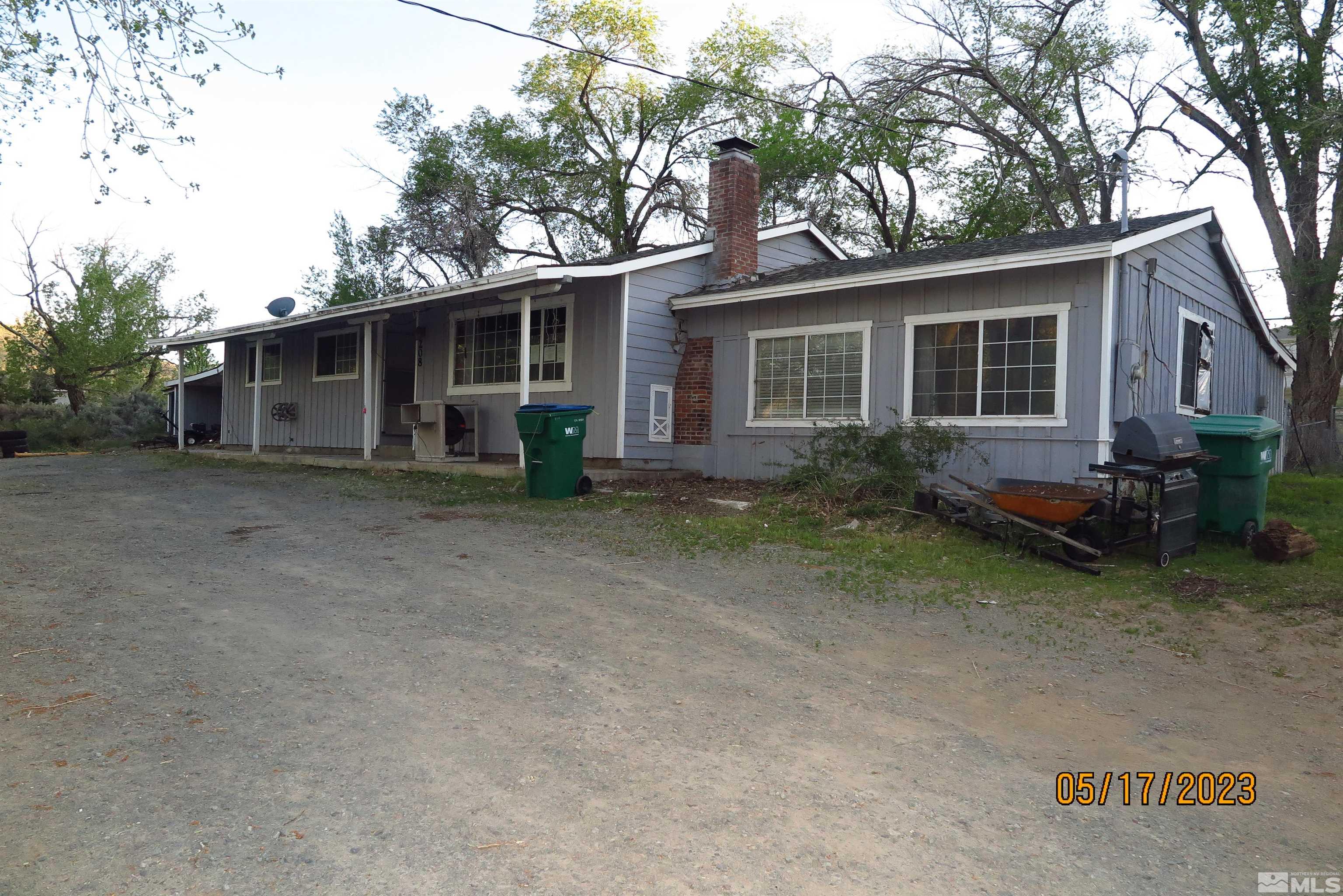 208 Rhodes Road Reno, NV 89521 - Photo 33 of 33 a view of a house with a yard and large tree