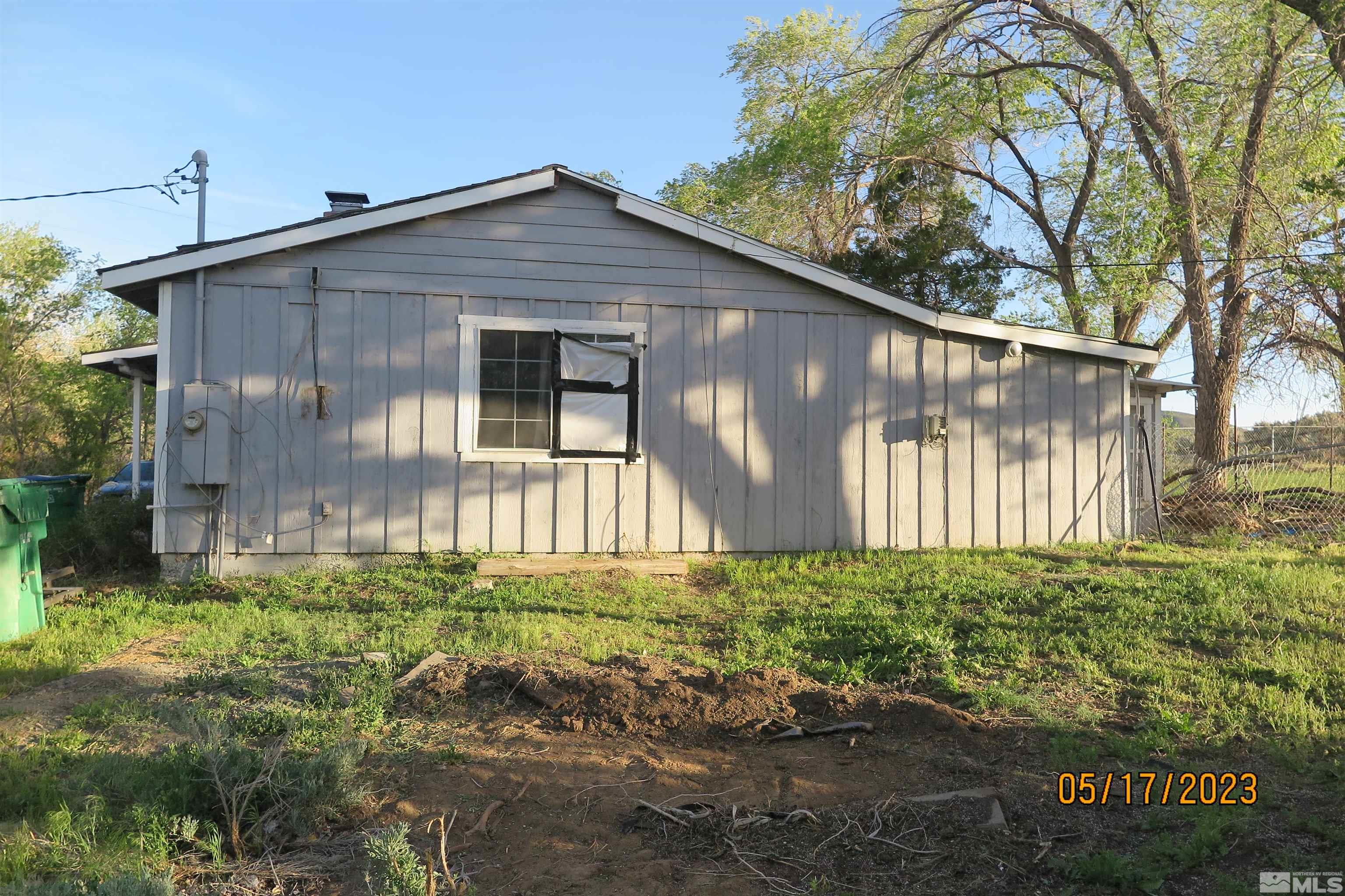 208 Rhodes Road Reno, NV 89521 - Photo 5 of 33 a front view of a house with a yard