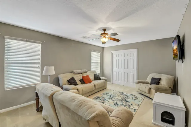 a living room with furniture and a window