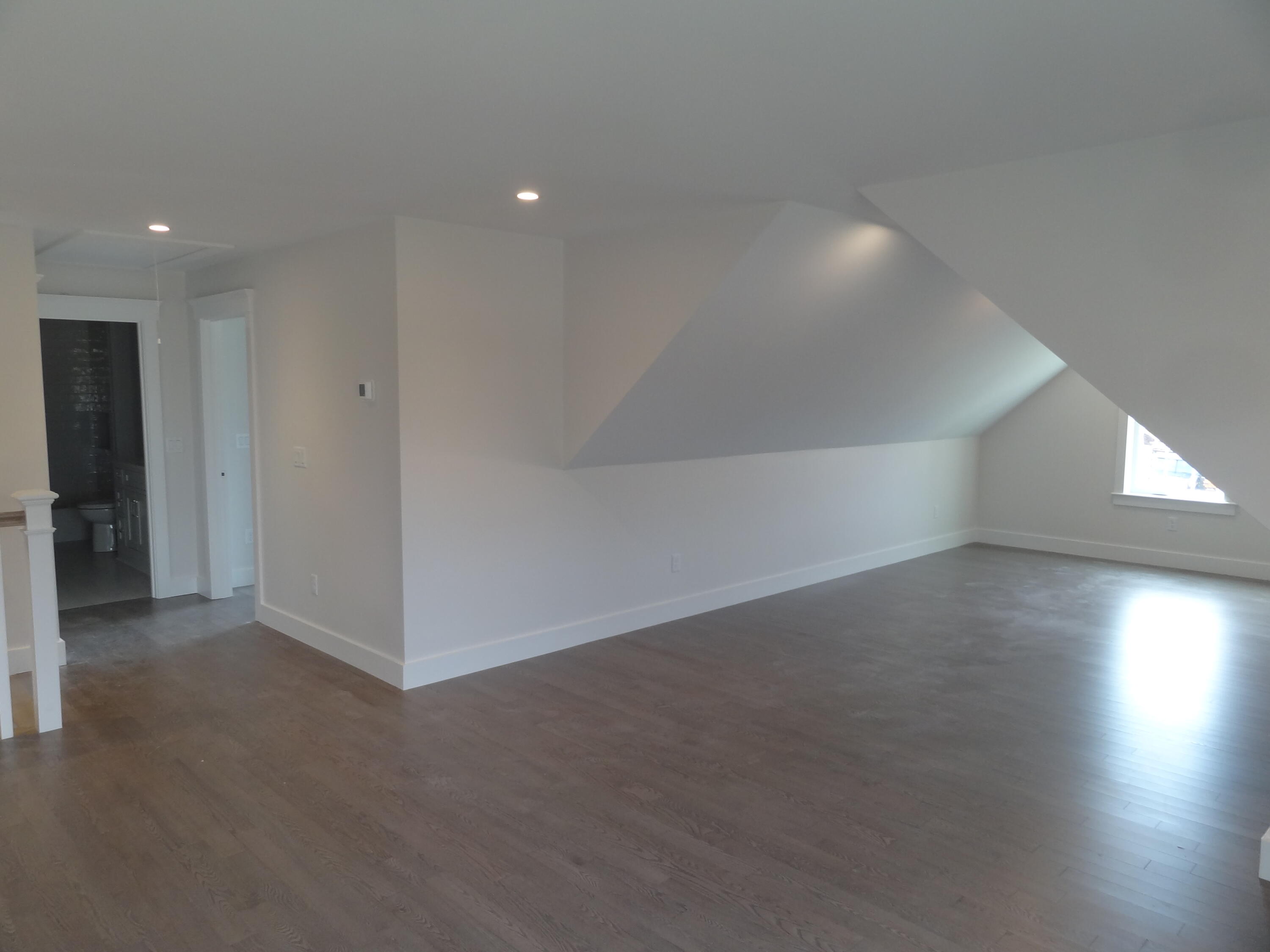 9 Cpe Clb Road East Falmouth, MA 02536 - Photo 19 of 58 an empty room with wooden floor and windows