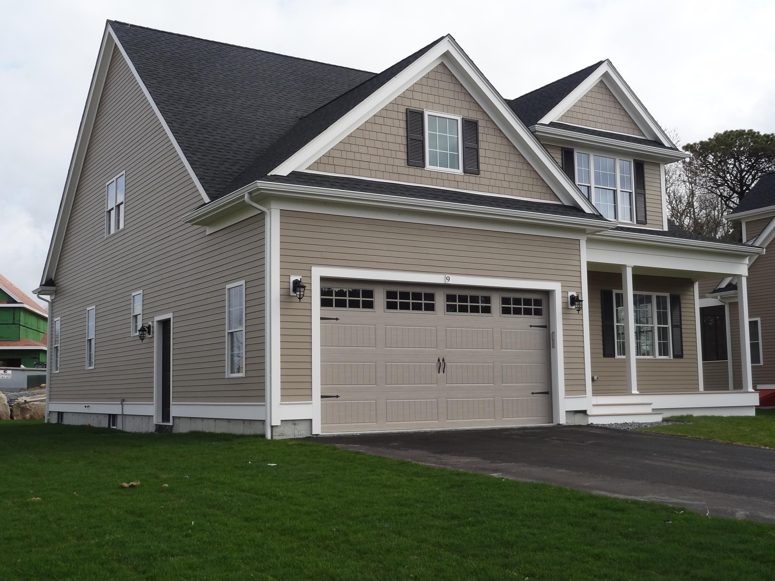 9 Cpe Clb Road East Falmouth, MA 02536 - Photo 2 of 58 a front view of a house with a garden