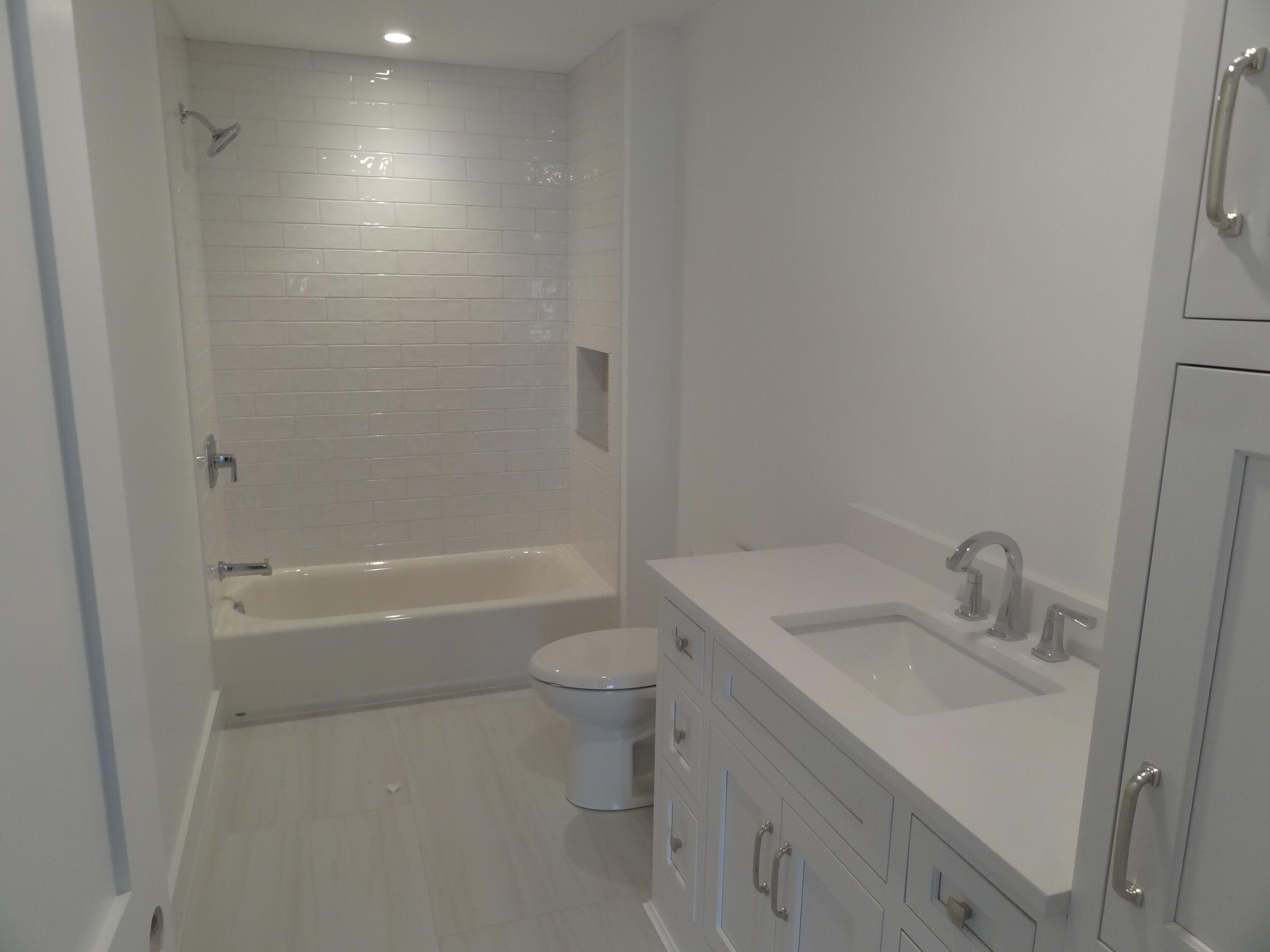 9 Cpe Clb Road East Falmouth, MA 02536 - Photo 22 of 58 a bathroom with a sink toilet vanity and bathtub