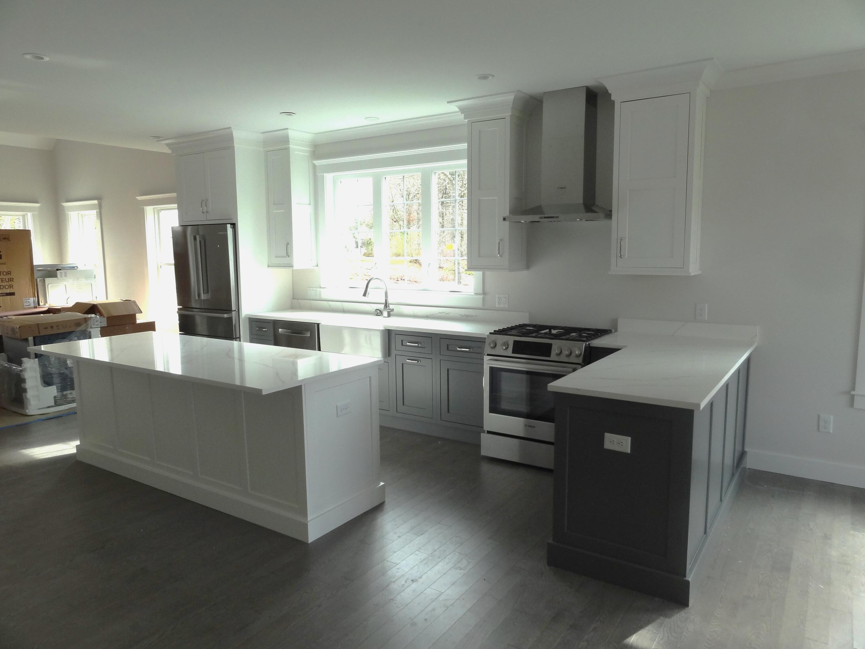 9 Cpe Clb Road East Falmouth, MA 02536 - Photo 7 of 58 a kitchen with a sink stove and cabinets
