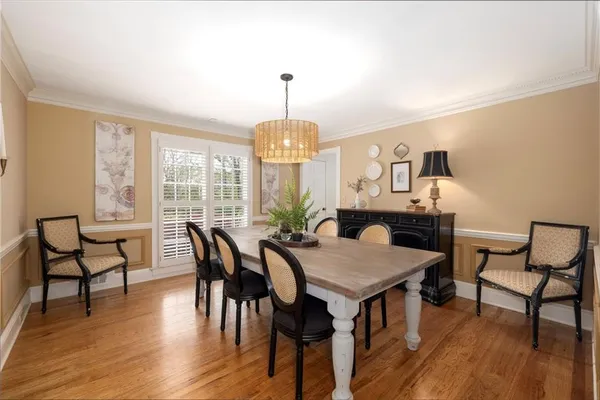 a kitchen with a stove sink and cabinets