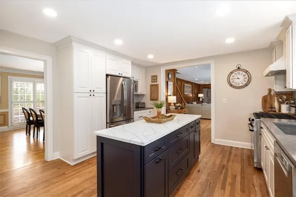 a white refrigerator freezer sitting in a kitchen