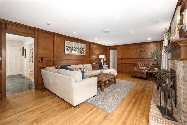 a bedroom with furniture and a flat screen tv
