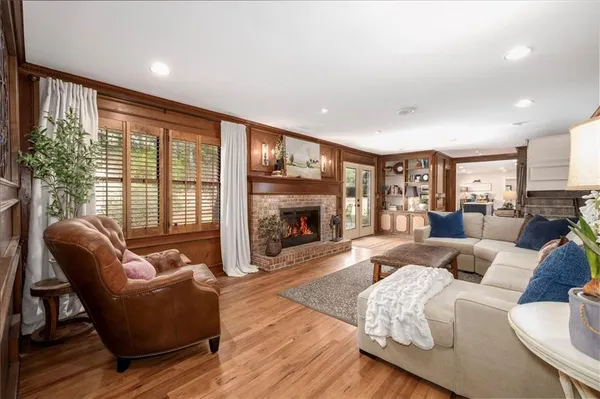 a bedroom with furniture and a wooden floor