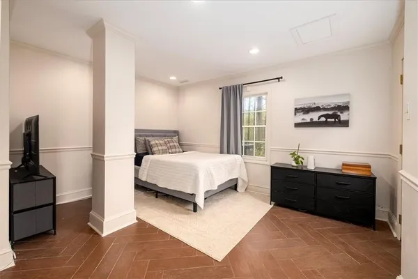 a view of swimming pool with lawn chairs and wooden fence