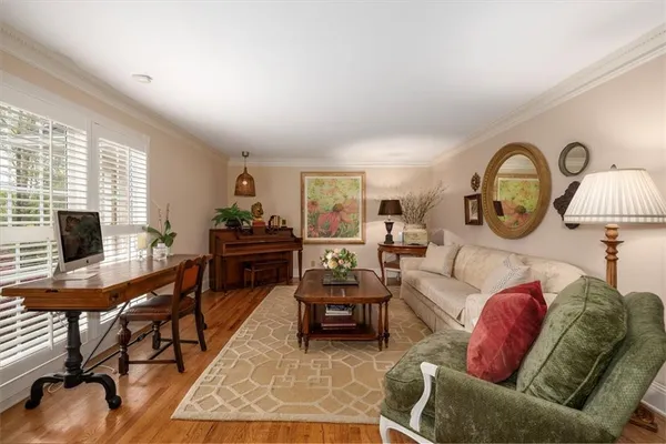 a view of a dining room with furniture and wooden floor