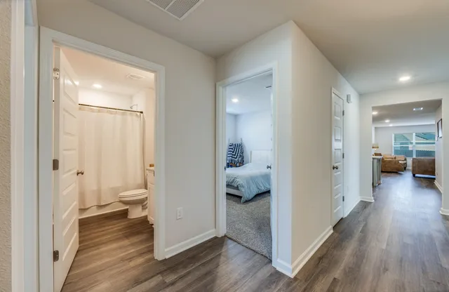 a view of a bathroom from a hallway