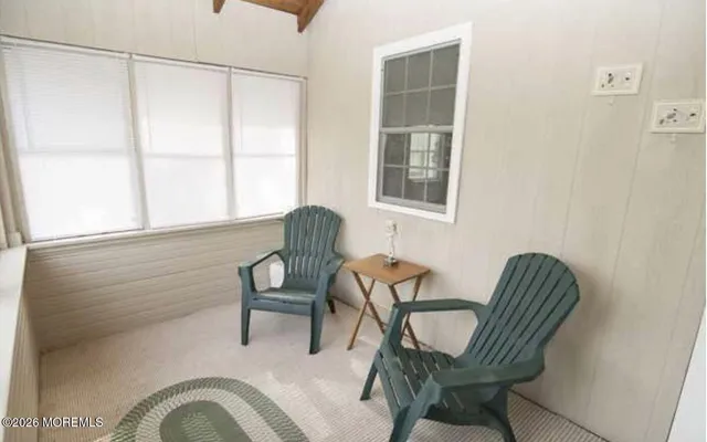 a view of a chair and table in the balcony