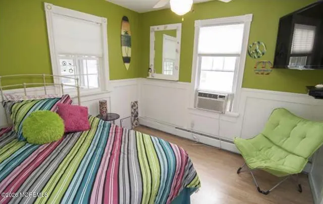 a living room filled with furniture and a potted plant