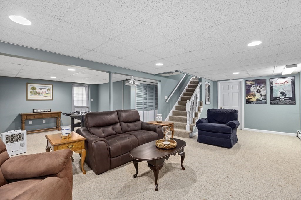 5 Atina Road Marshfield, MA 02050 - Photo 21 of 39 a living room with furniture and a wooden floor