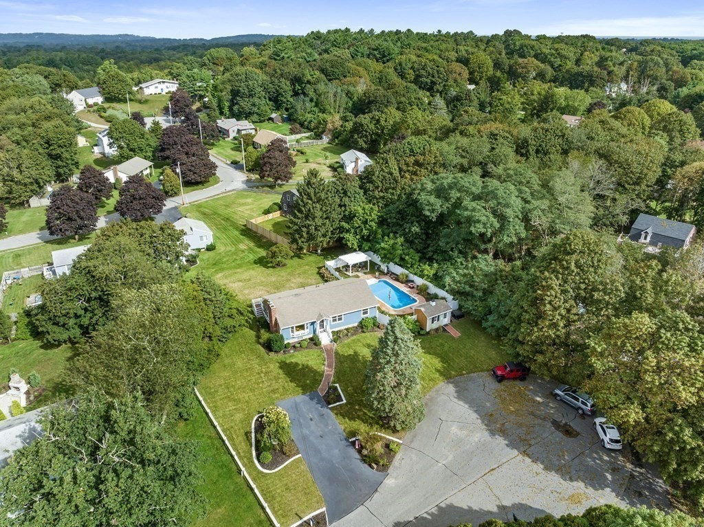 5 Atina Road Marshfield, MA 02050 - Photo 36 of 39 a view of a garden with a building in the background