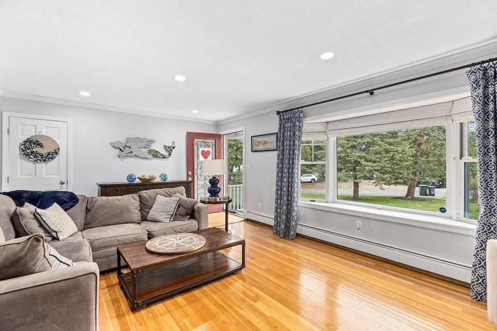 5 Atina Road Marshfield, MA 02050 - Photo 5 of 39 a living room with furniture and a large window