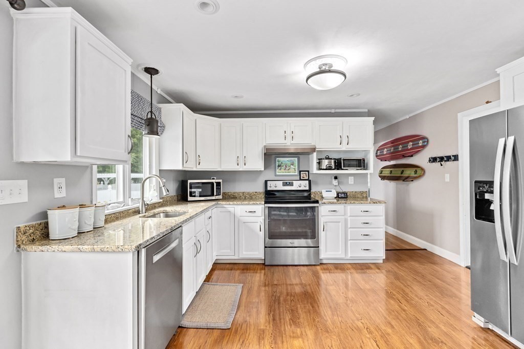 5 Atina Road Marshfield, MA 02050 - Photo 8 of 39 a kitchen with stainless steel appliances granite countertop a refrigerator and a stove top oven