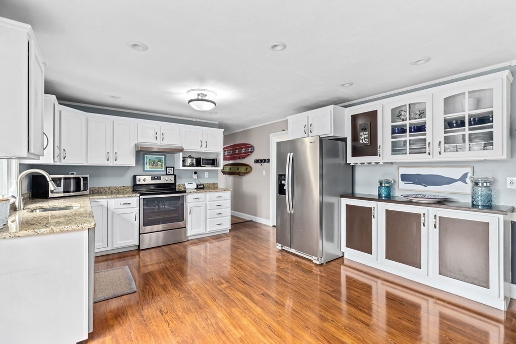 5 Atina Road Marshfield, MA 02050 - Photo 10 of 39 a kitchen with stainless steel appliances a refrigerator and a stove top oven
