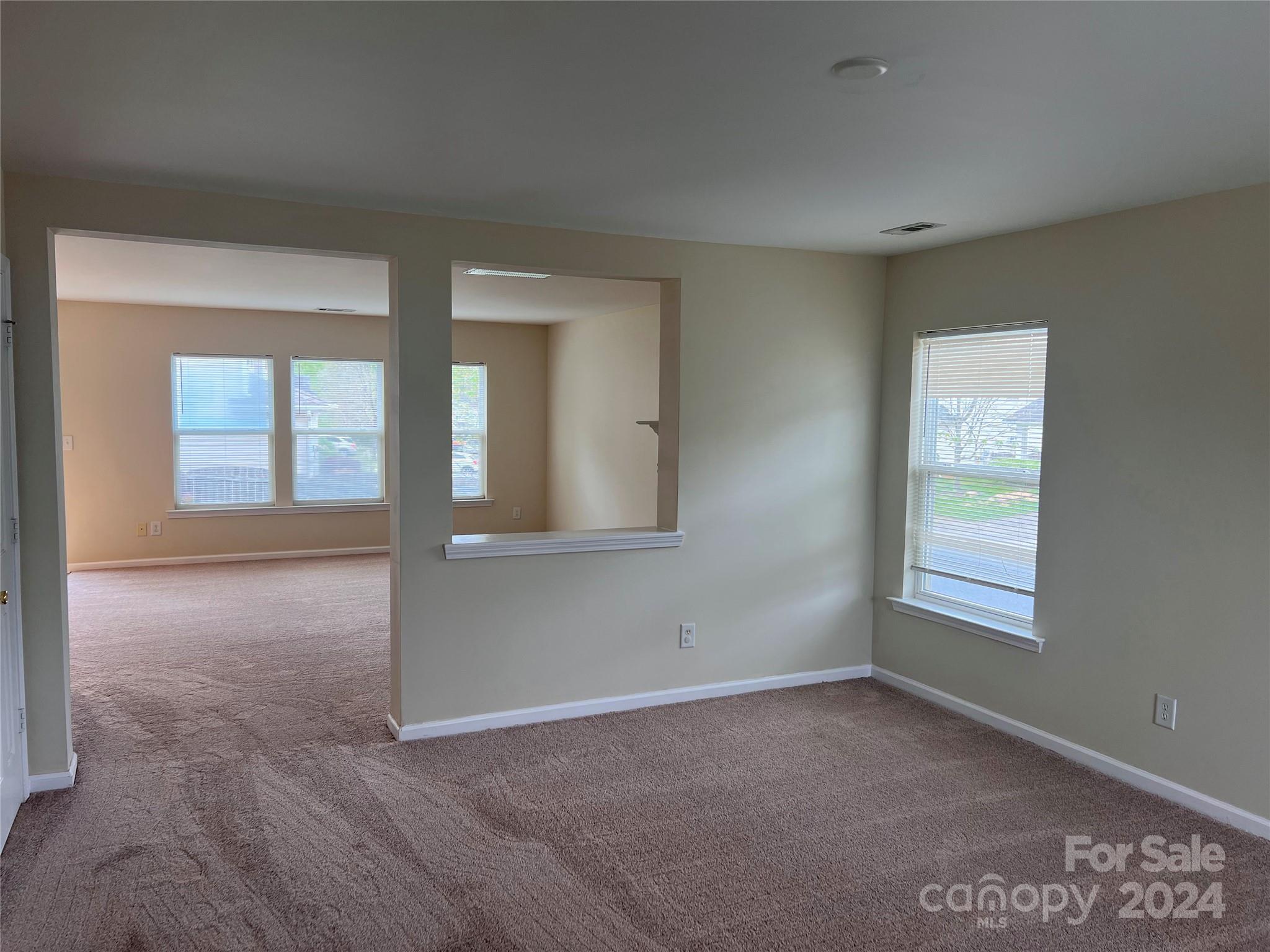 6702 Ferrell Commons Road Charlotte, NC 28269 - Photo 3 of 20 a view of an empty room with a window