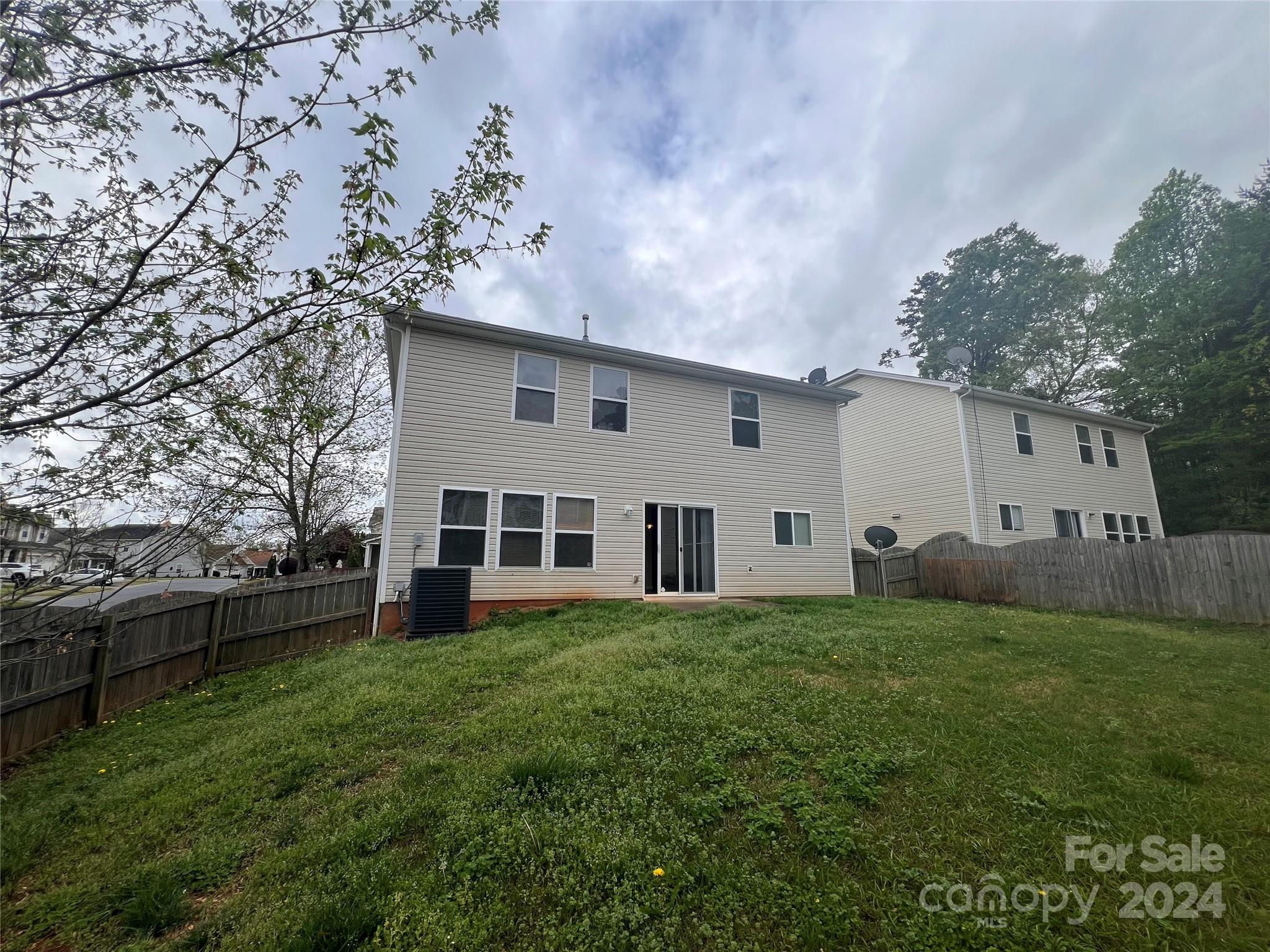 6702 Ferrell Commons Road Charlotte, NC 28269 - Photo 9 of 20 a view of a house with a yard