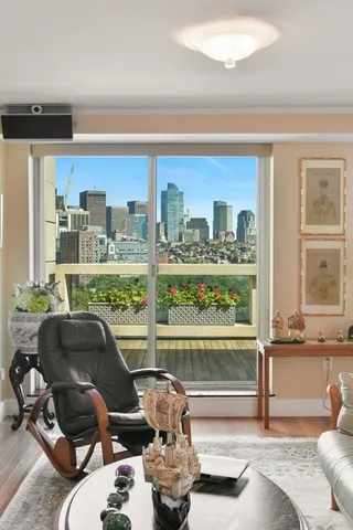 a room with furniture and a large window