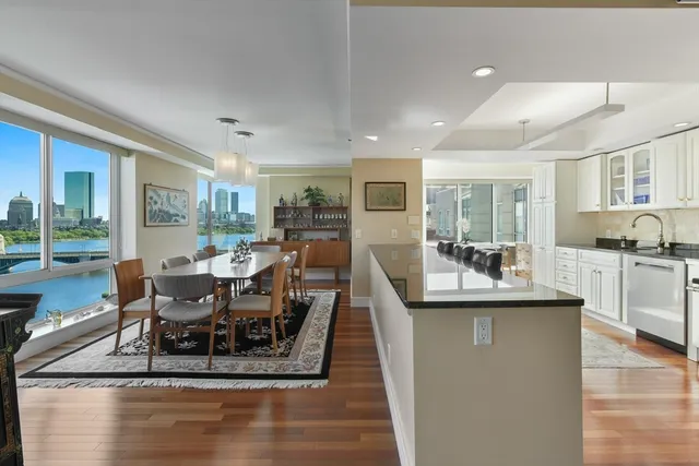 a dining room with furniture and wooden floor