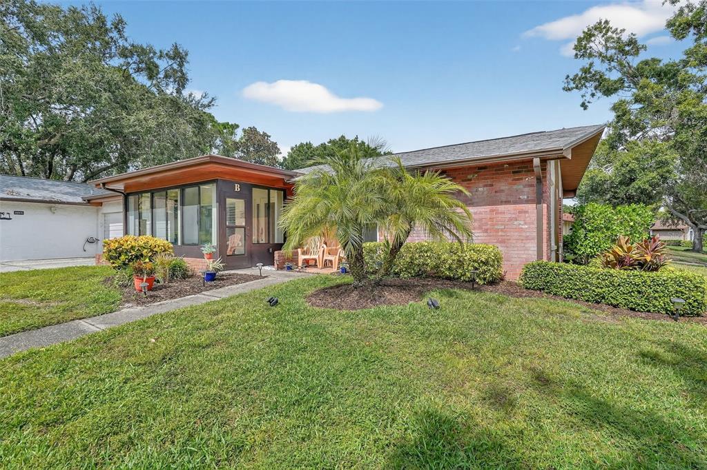 a front view of a house with garden