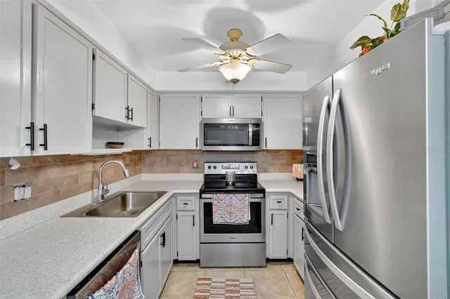 a kitchen with a stove microwave and refrigerator
