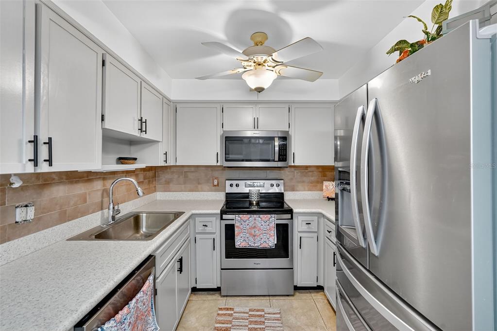 2320 Shelly Drive, Unit B Palm Harbor, FL 34684 - Photo 15 of 30 a kitchen with a stove microwave and refrigerator
