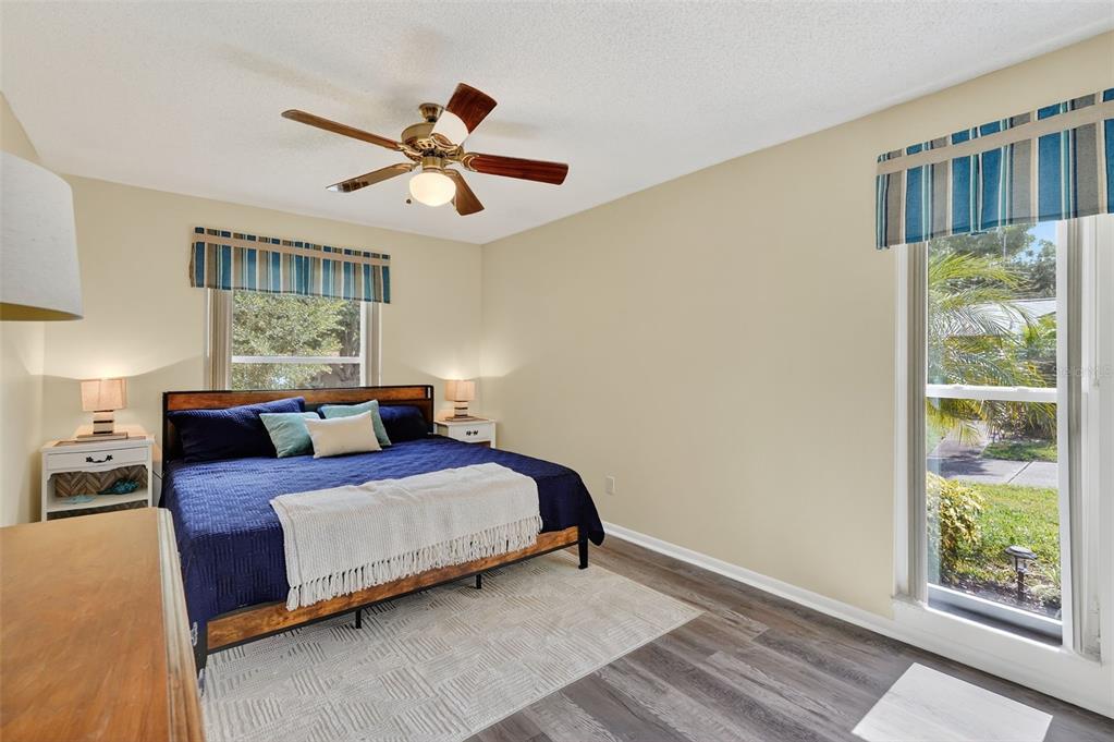 2320 Shelly Drive, Unit B Palm Harbor, FL 34684 - Photo 20 of 30 a bedroom with a bed and wooden floor
