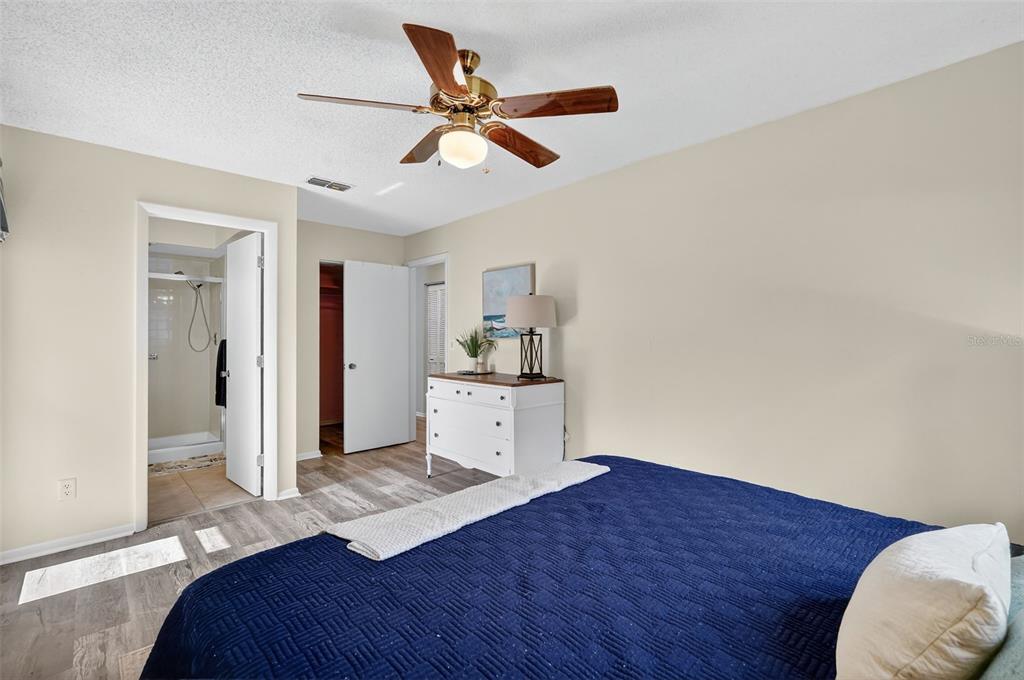 2320 Shelly Drive, Unit B Palm Harbor, FL 34684 - Photo 21 of 30 a bedroom with a bed and a dresser