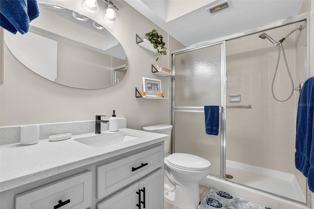 2320 Shelly Drive, Unit B Palm Harbor, FL 34684 - Photo 24 of 30 a bathroom with a sink a toilet and shower