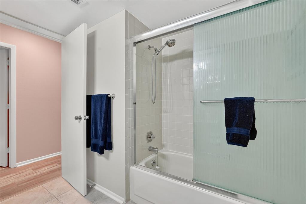 2320 Shelly Drive, Unit B Palm Harbor, FL 34684 - Photo 28 of 30 a bathroom with a bathtub and a shower