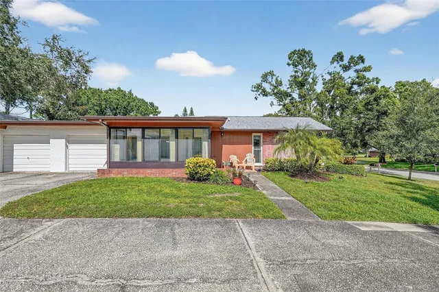 a view of a house with a yard
