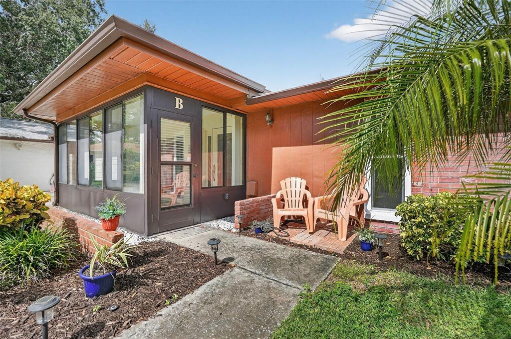 2320 Shelly Drive, Unit B Palm Harbor, FL 34684 - Photo 7 of 30 a front view of a house with garden