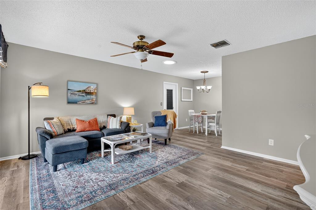 2320 Shelly Drive, Unit B Palm Harbor, FL 34684 - Photo 10 of 30 a living room with furniture and a wooden floor